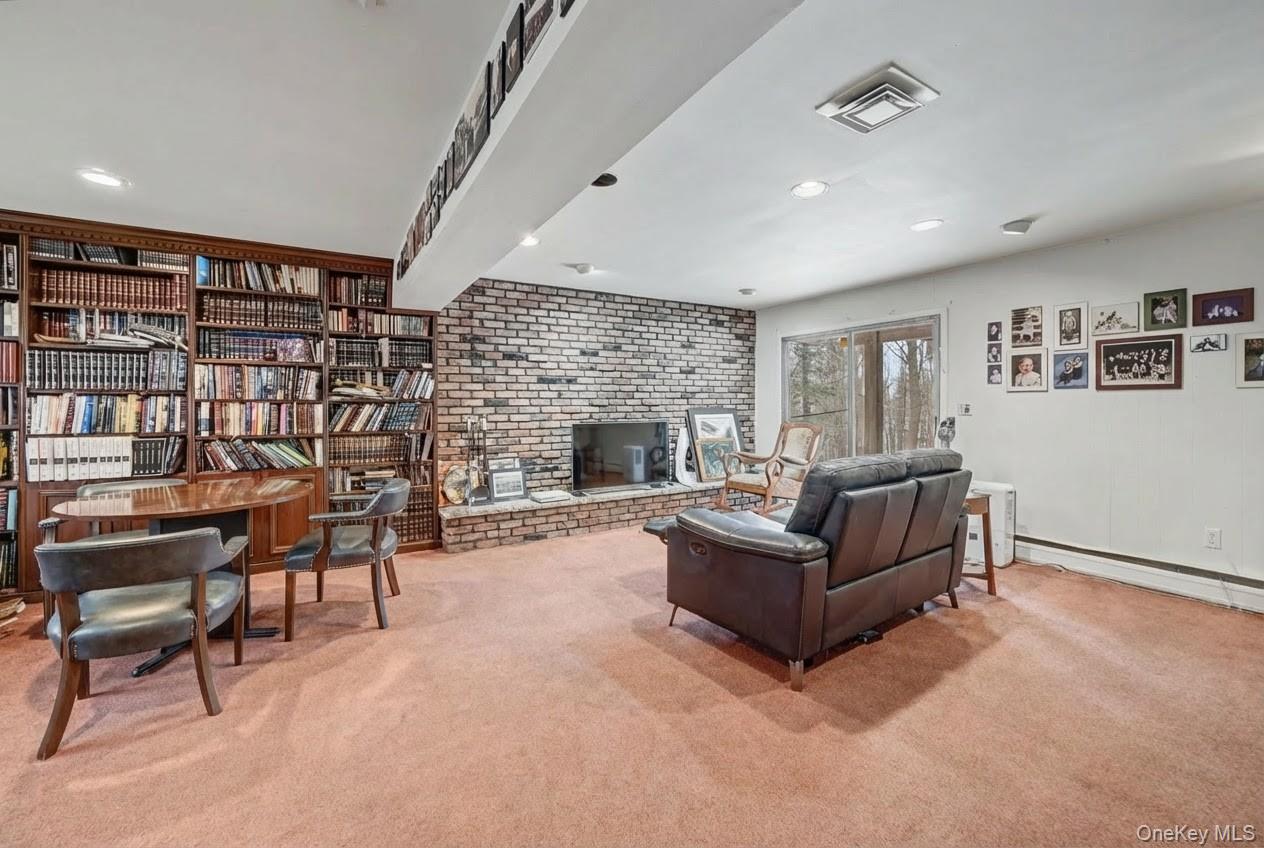 6 Kakiat Lane Spring Valley, NY 10977 - Photo 19 of 25 a living room with furniture and a fireplace