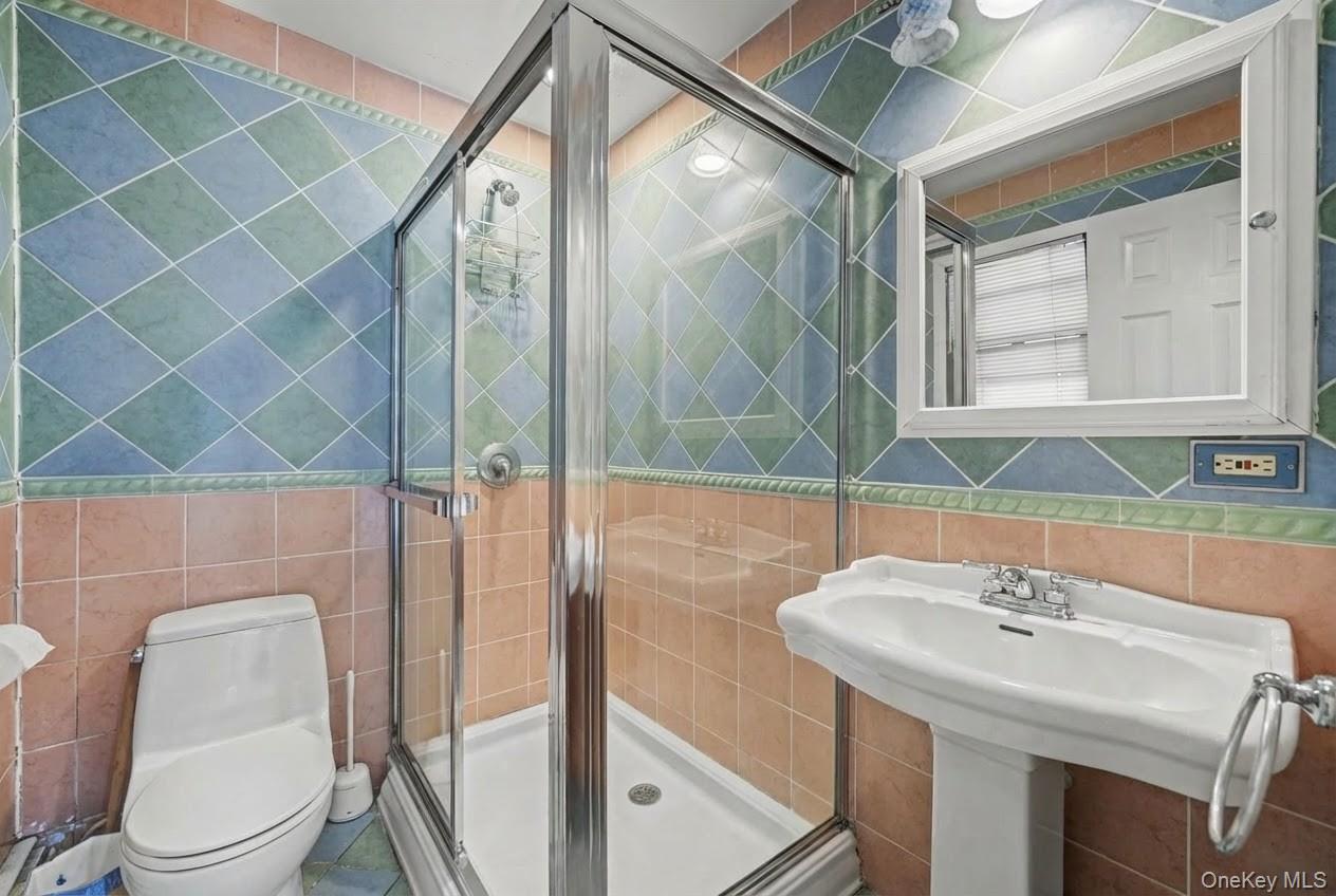 6 Kakiat Lane Spring Valley, NY 10977 - Photo 21 of 25 a bathroom with a sink and a mirror