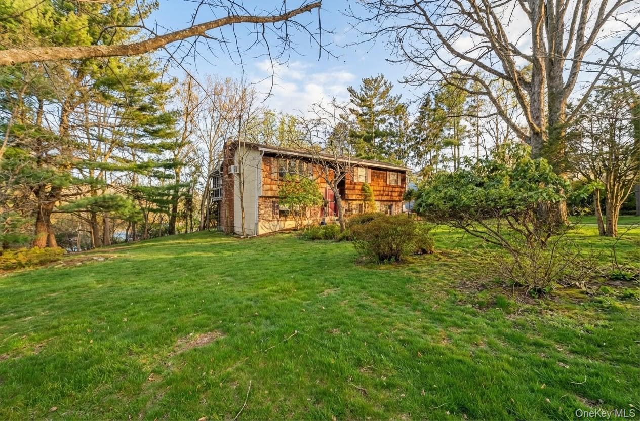6 Kakiat Lane Spring Valley, NY 10977 - Photo 3 of 25 a view of backyard with garden
