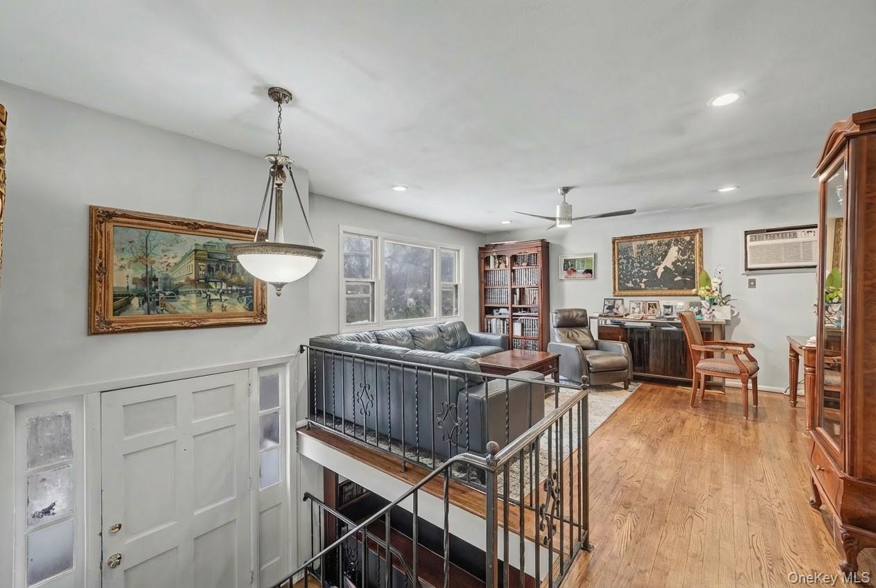 6 Kakiat Lane Spring Valley, NY 10977 - Photo 7 of 25 a view of a livingroom with furniture wooden floor and a chandelier