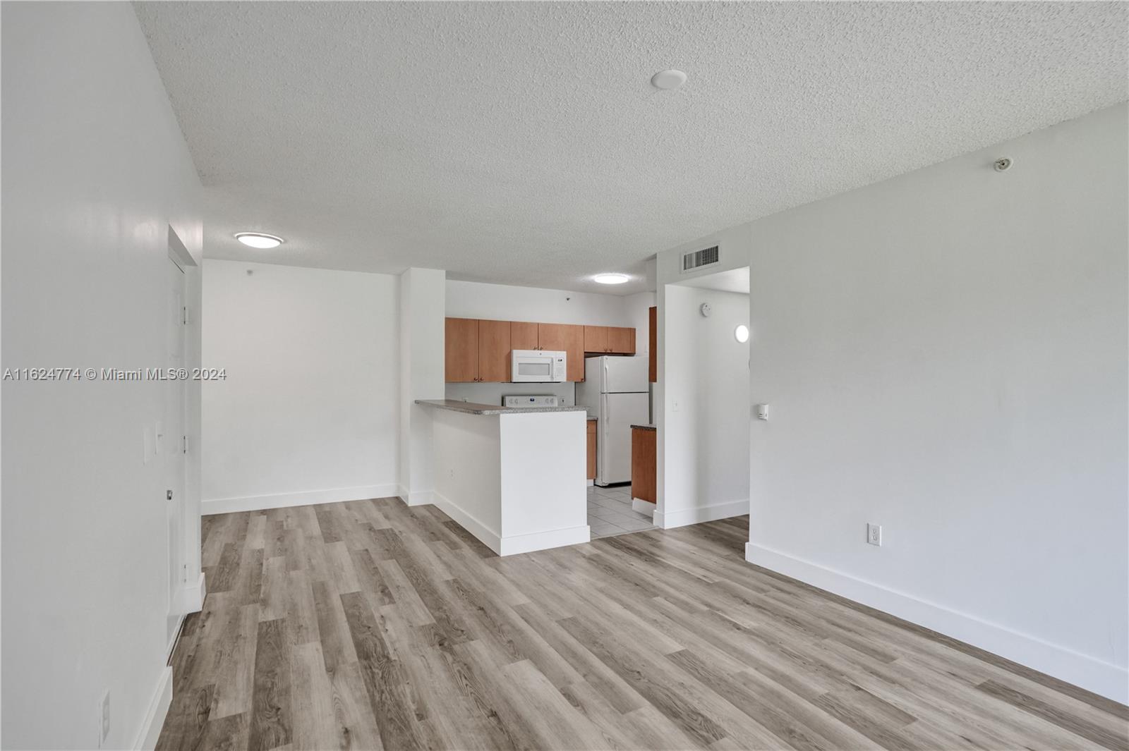 8010 North Nob Hill Road, Unit 108 Tamarac, FL 33321 - Photo 9 of 35 New vinyl plank floors!