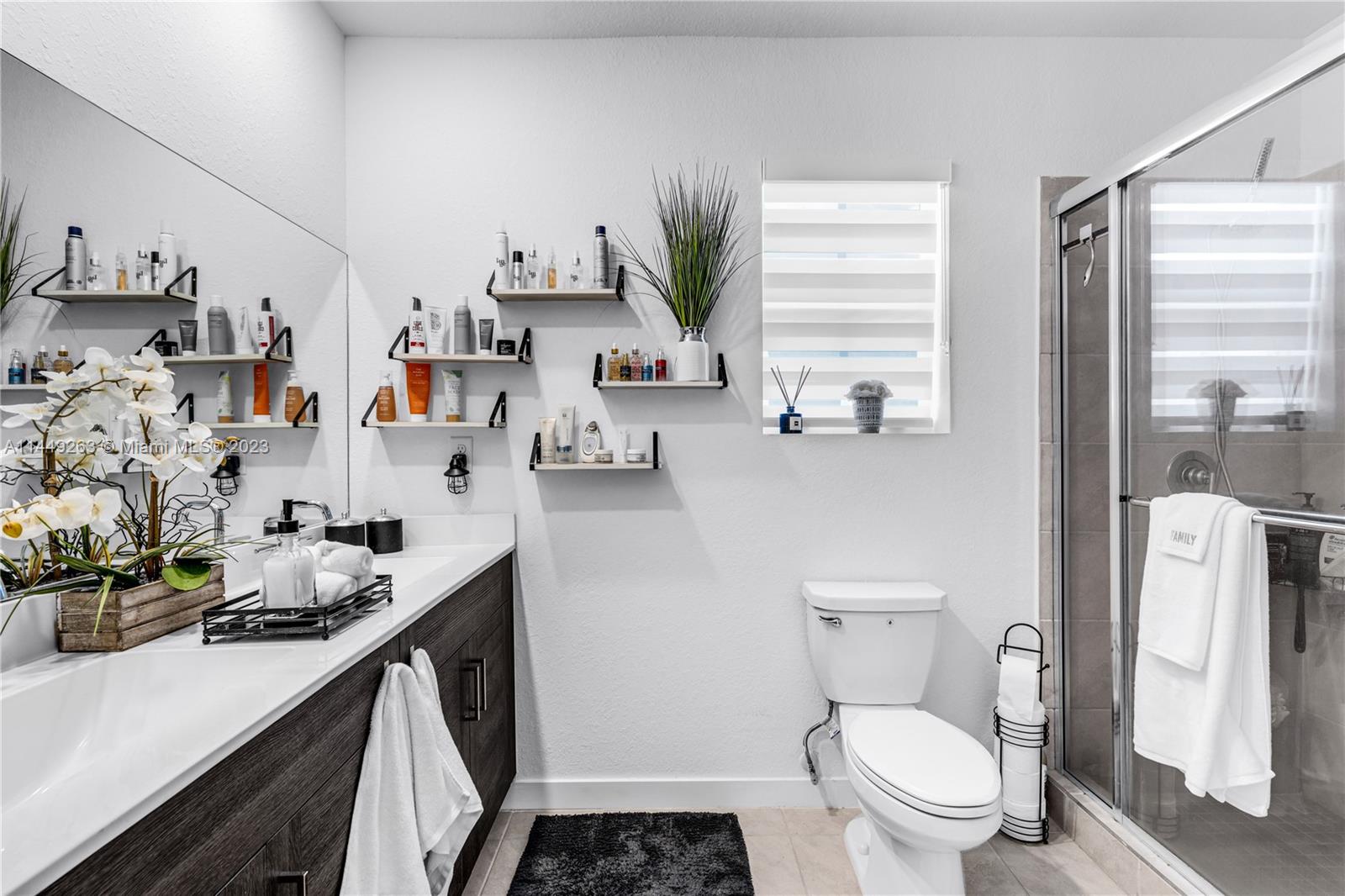 781 Southeast 19th Street Homestead, FL 33034 - Photo 24 of 41 a bathroom with sink a toilet and window