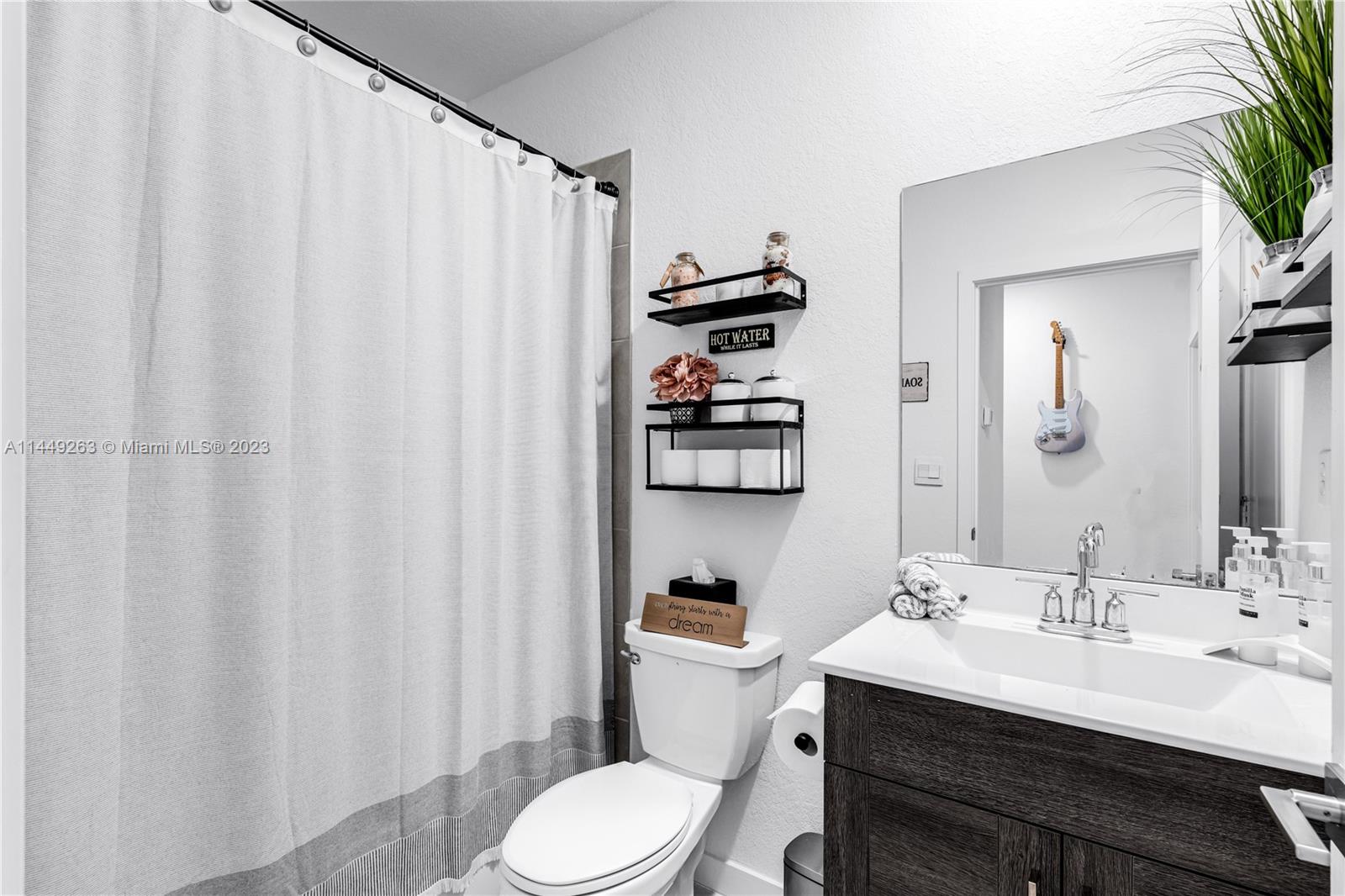 781 Southeast 19th Street Homestead, FL 33034 - Photo 28 of 41 a bathroom with a sink toilet and shower
