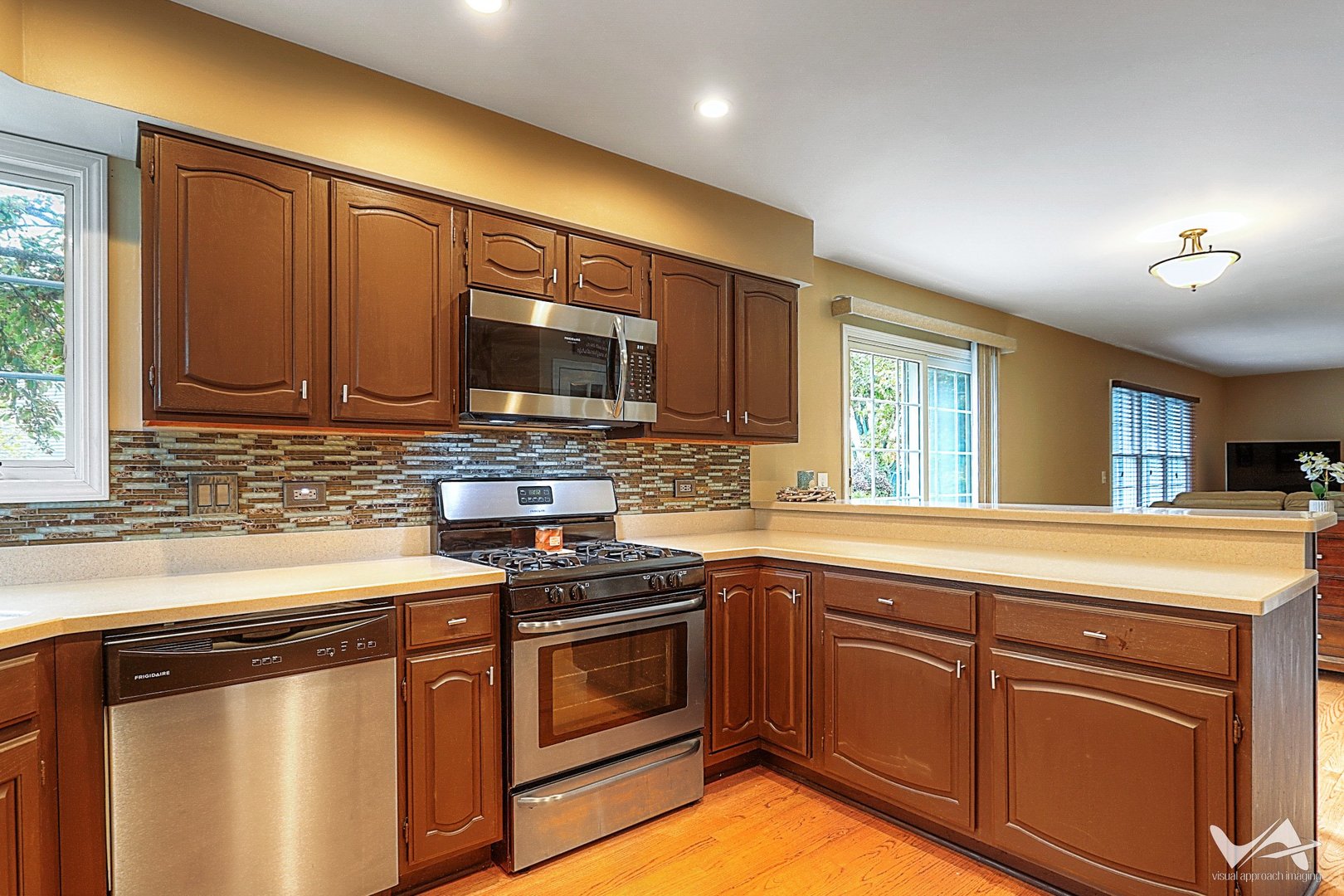 809 Arrowhead Lane St. Charles, IL 60174 - Photo 13 of 38 a kitchen with stainless steel appliances granite countertop a sink stove and microwave