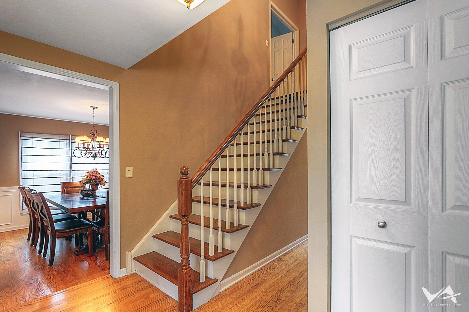 809 Arrowhead Lane St. Charles, IL 60174 - Photo 18 of 38 a view of entryway dining room and hall with wooden floor