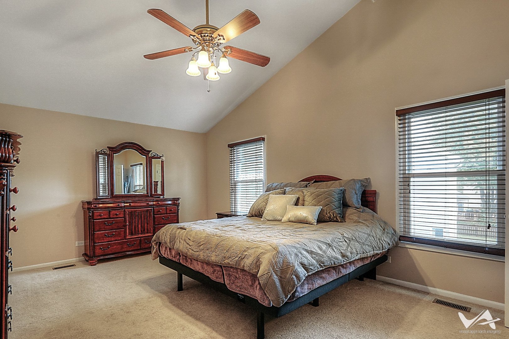 809 Arrowhead Lane St. Charles, IL 60174 - Photo 19 of 38 a bedroom with a large bed and a dresser