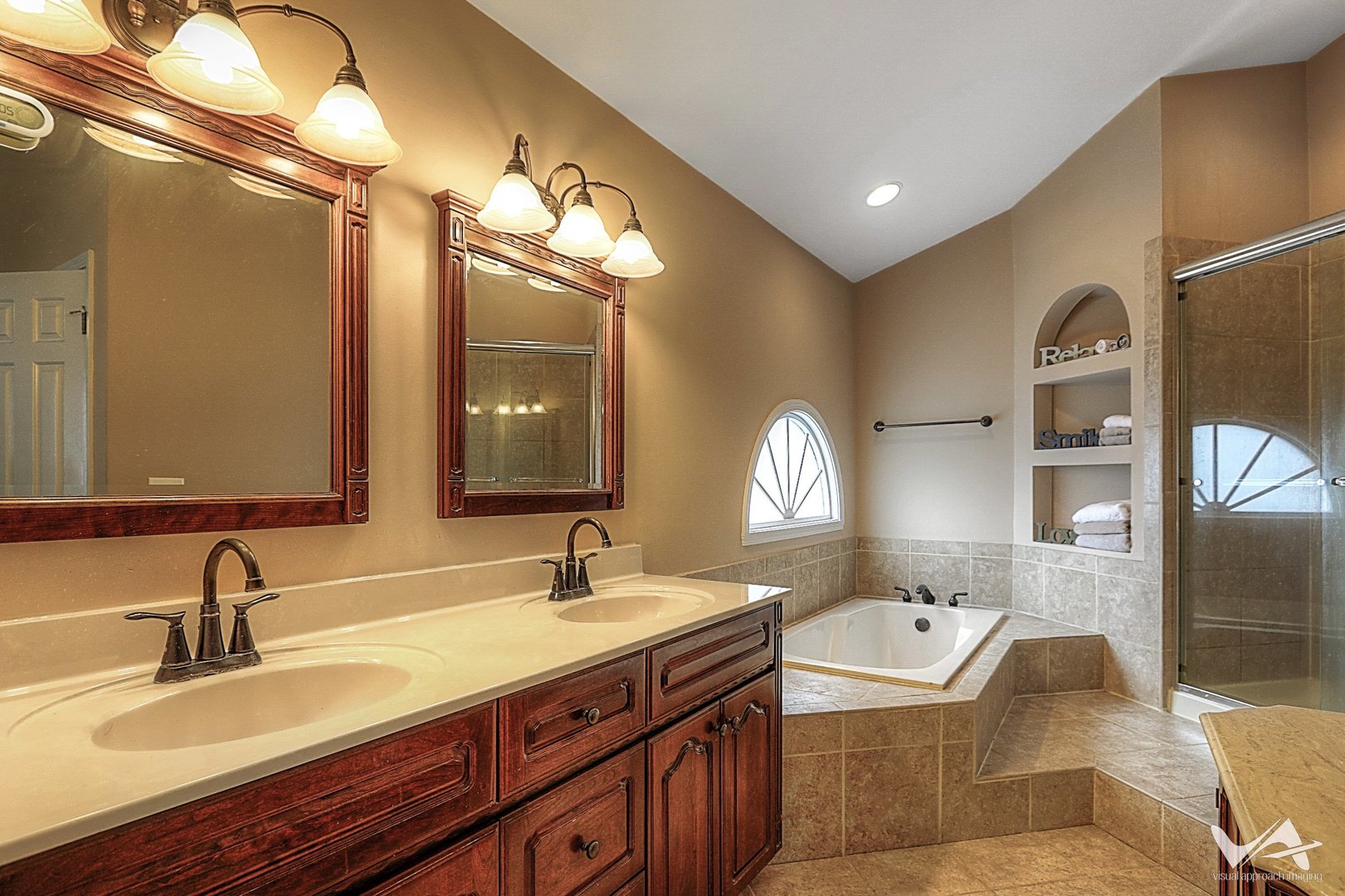 809 Arrowhead Lane St. Charles, IL 60174 - Photo 20 of 38 a bathroom with a granite countertop sink mirror and bathtub