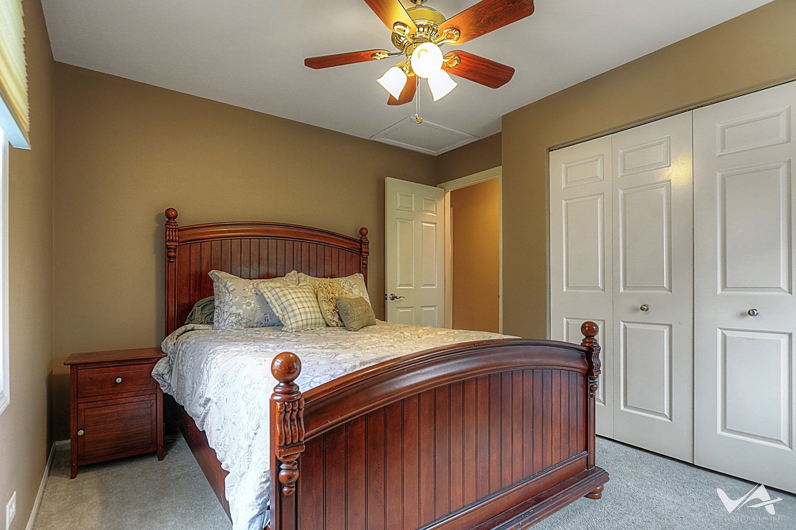 809 Arrowhead Lane St. Charles, IL 60174 - Photo 22 of 38 a bedroom with a bed and a chandelier