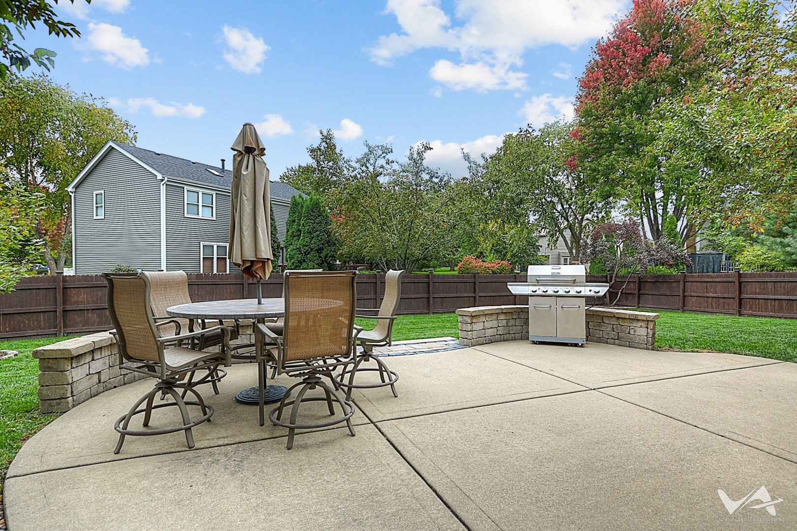 809 Arrowhead Lane St. Charles, IL 60174 - Photo 30 of 38 a view of a patio with a table and chairs