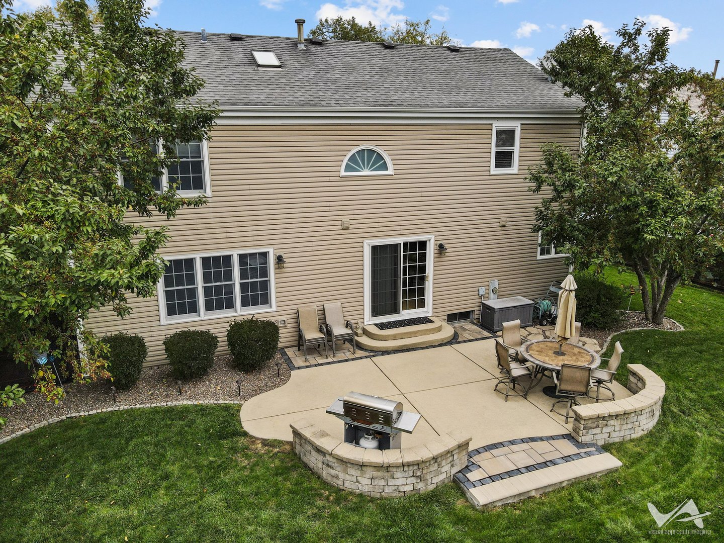809 Arrowhead Lane St. Charles, IL 60174 - Photo 31 of 38 a view of a patio with couches chairs and a fire pit