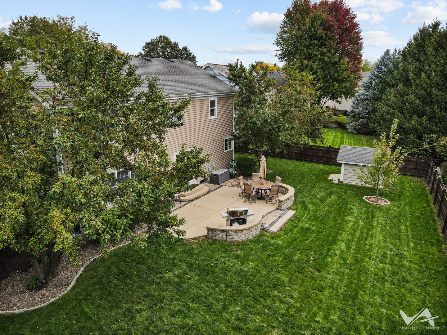 809 Arrowhead Lane St. Charles, IL 60174 - Photo 32 of 38 a view of a chair and table on the green field