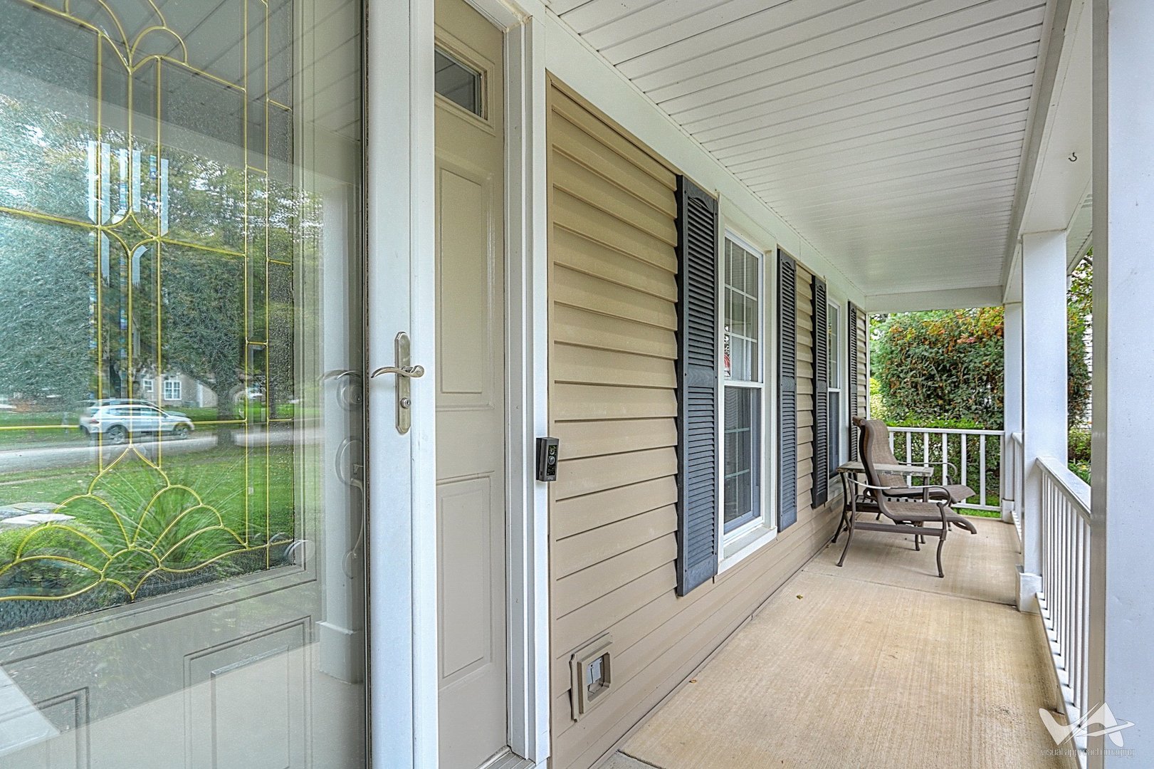 809 Arrowhead Lane St. Charles, IL 60174 - Photo 6 of 38 a balcony with chairs and a table