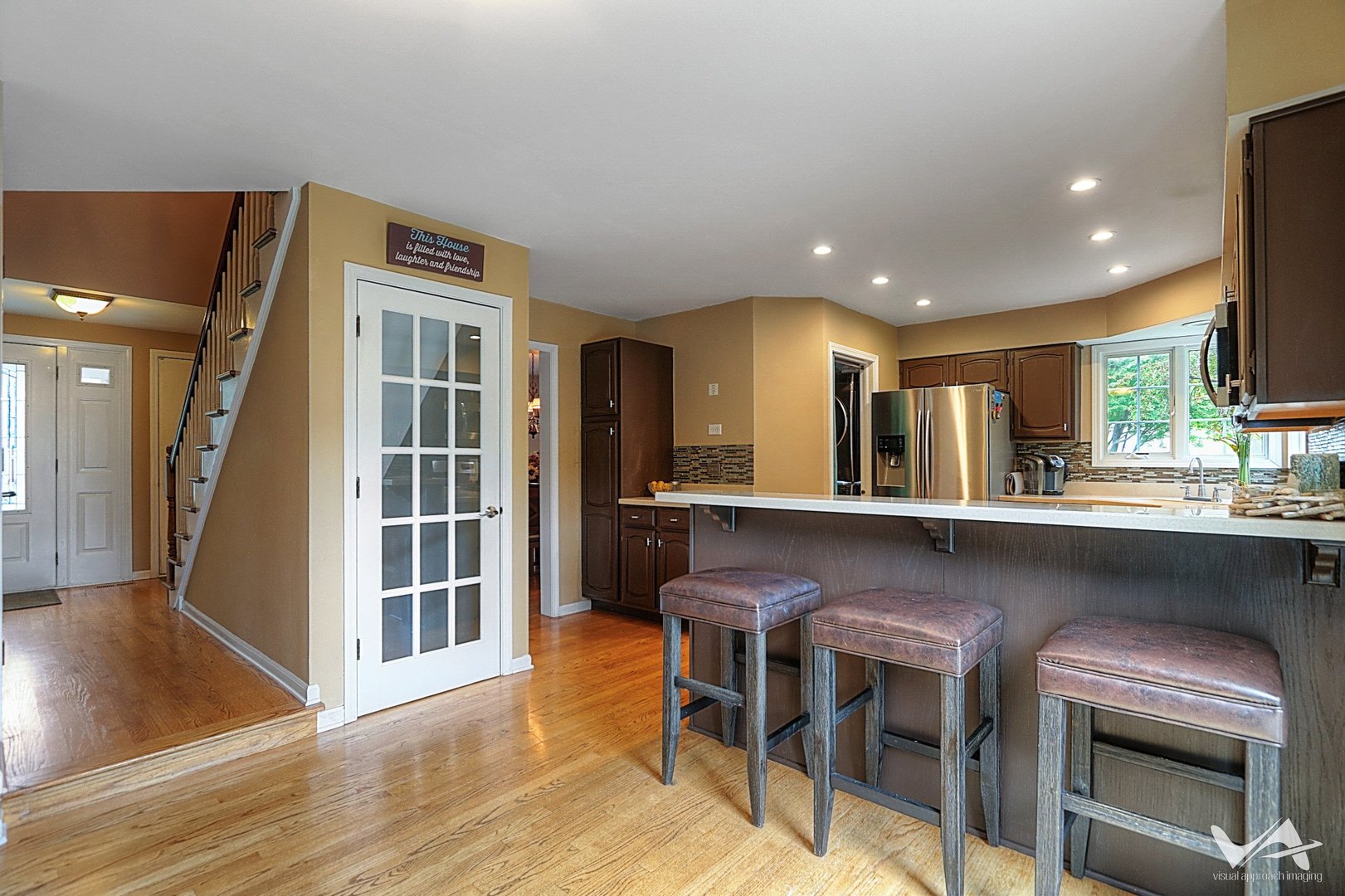 809 Arrowhead Lane St. Charles, IL 60174 - Photo 10 of 38 a kitchen with a sink cabinets and window