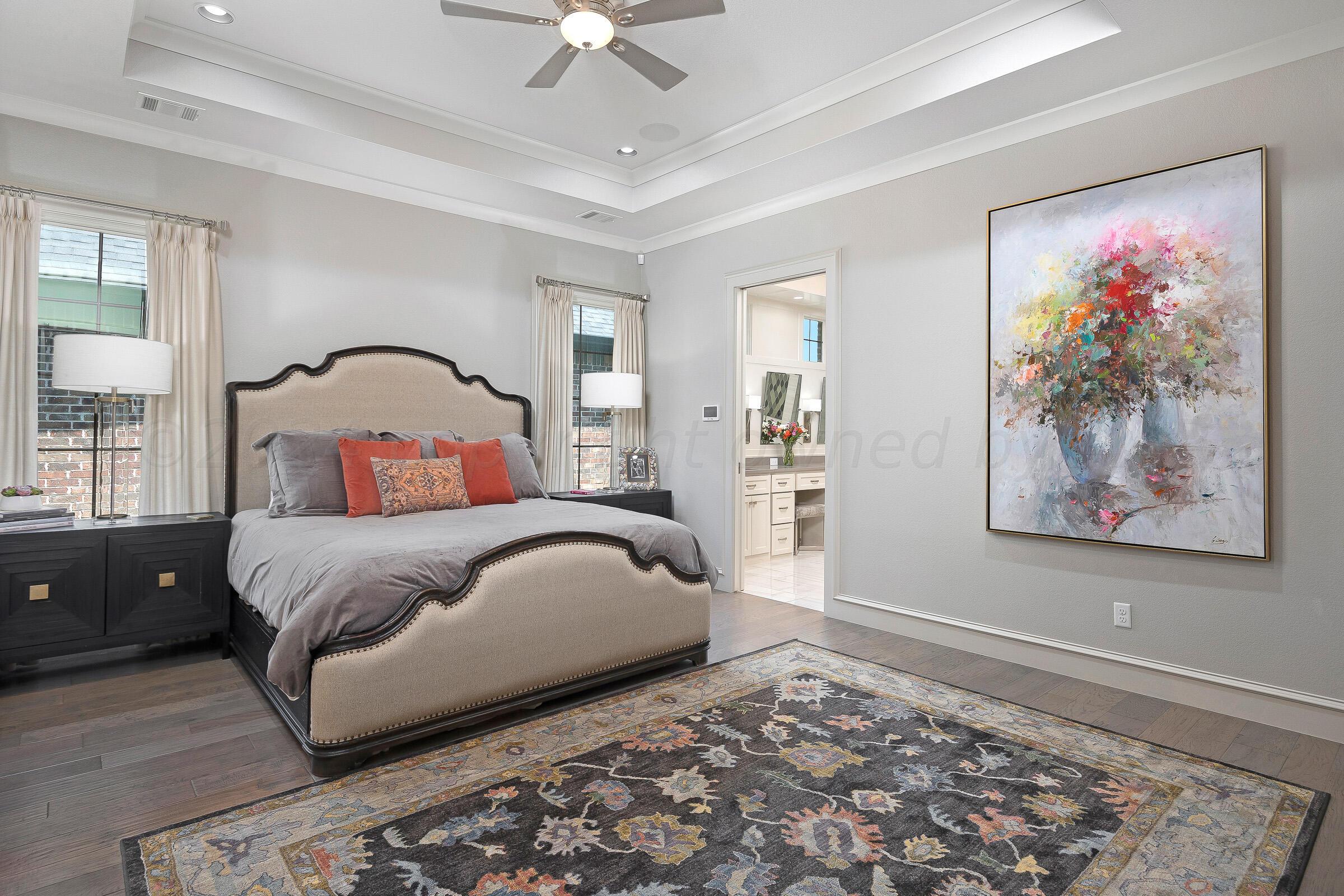 8307 Georgetown Drive Amarillo, TX 79119 - Photo 16 of 46 a bedroom with bed and a painting on the wall