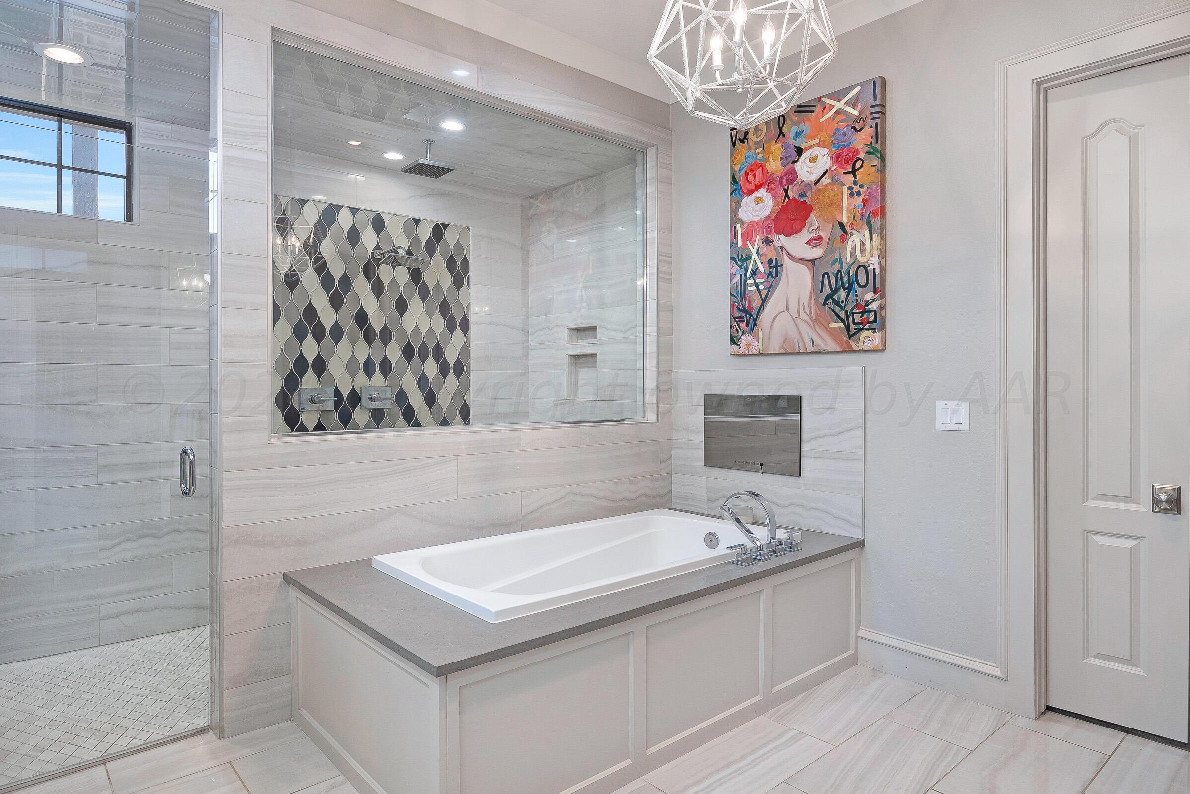 8307 Georgetown Drive Amarillo, TX 79119 - Photo 20 of 46 a bathroom with a sink a vanity and a bathtub