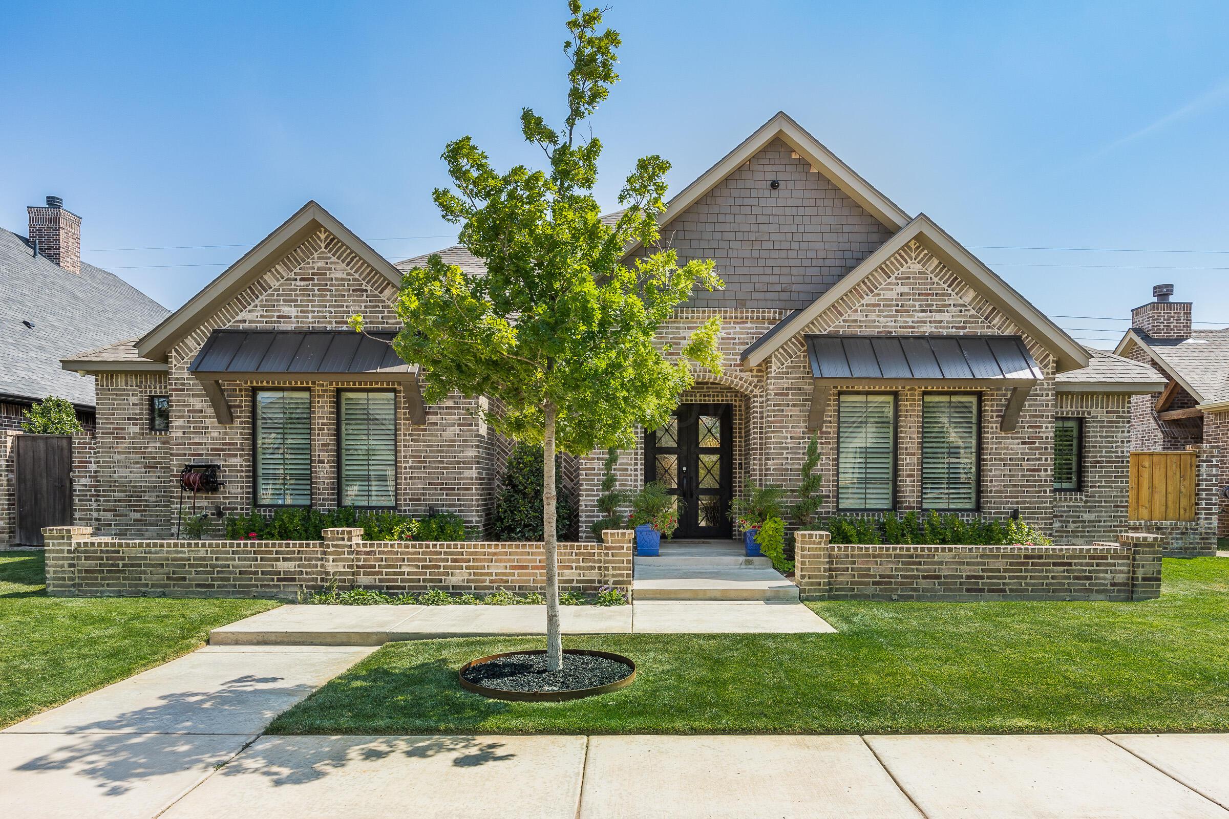 8307 Georgetown Drive Amarillo, TX 79119 - Photo 2 of 46 a front view of a house with a yard