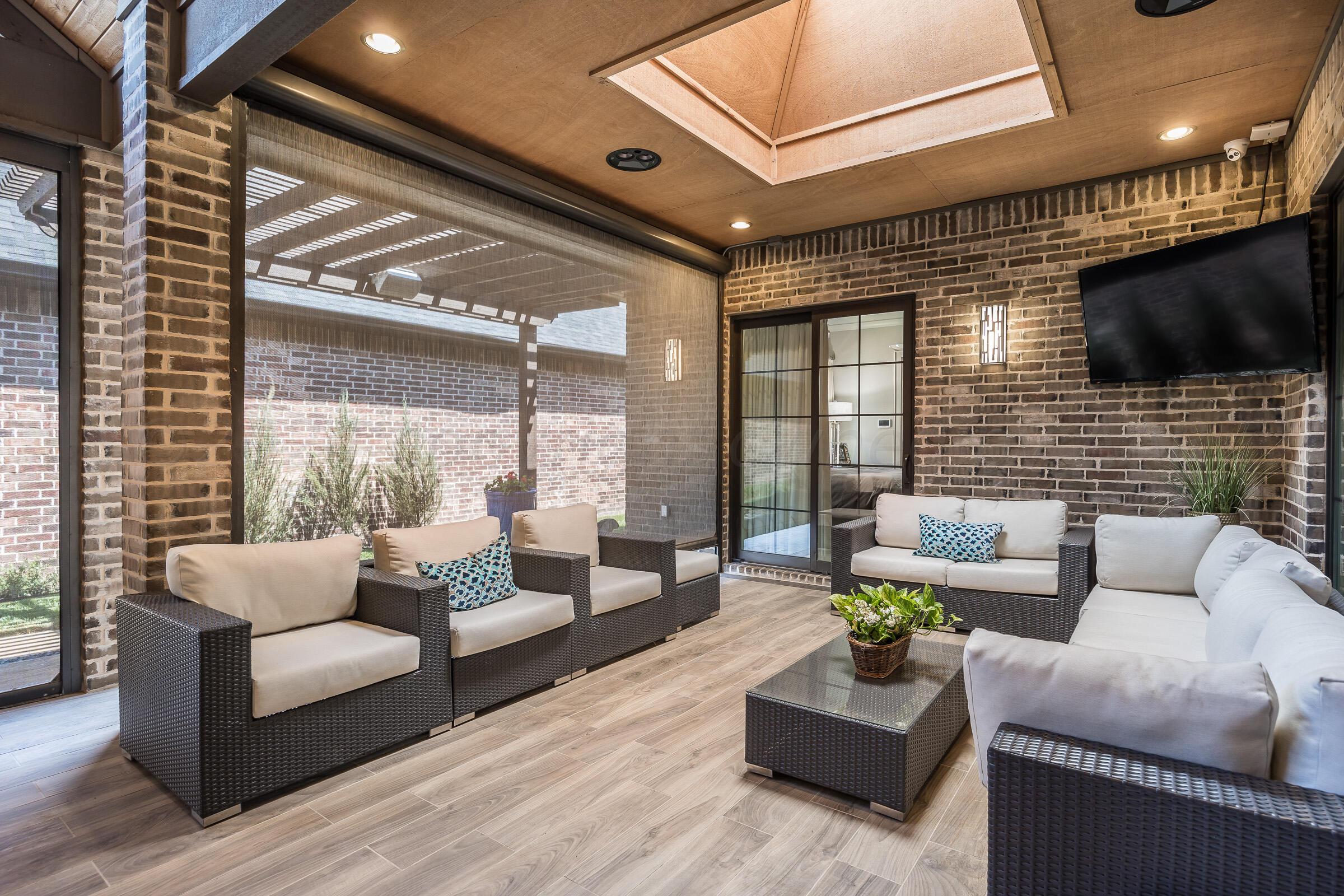 8307 Georgetown Drive Amarillo, TX 79119 - Photo 38 of 46 a living room with furniture and a flat screen tv