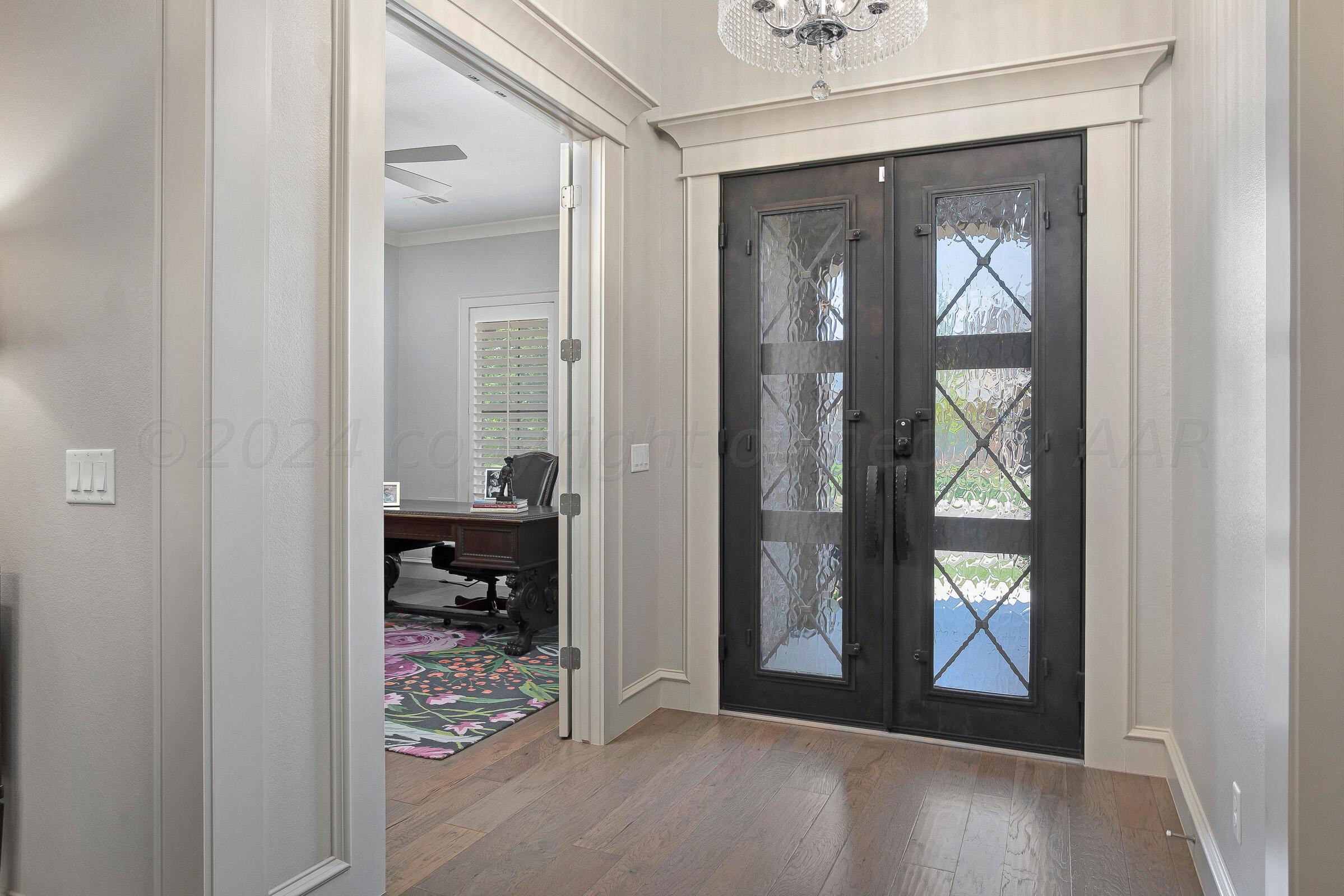8307 Georgetown Drive Amarillo, TX 79119 - Photo 6 of 46 a view of a hallway view with wooden floor and a livingroom view