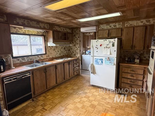 2934 East Little Basin Road King Hill, ID 83633 - Photo 11 of 29 Kitchen featuring white appliances, parquet floors, wooden ceiling, and brown cabinets