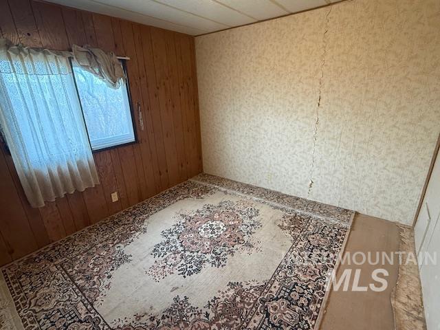 2934 East Little Basin Road King Hill, ID 83633 - Photo 19 of 29 Empty room with wood walls