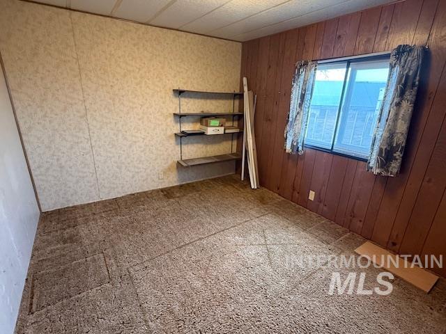 2934 East Little Basin Road King Hill, ID 83633 - Photo 20 of 29 Empty room featuring wooden walls