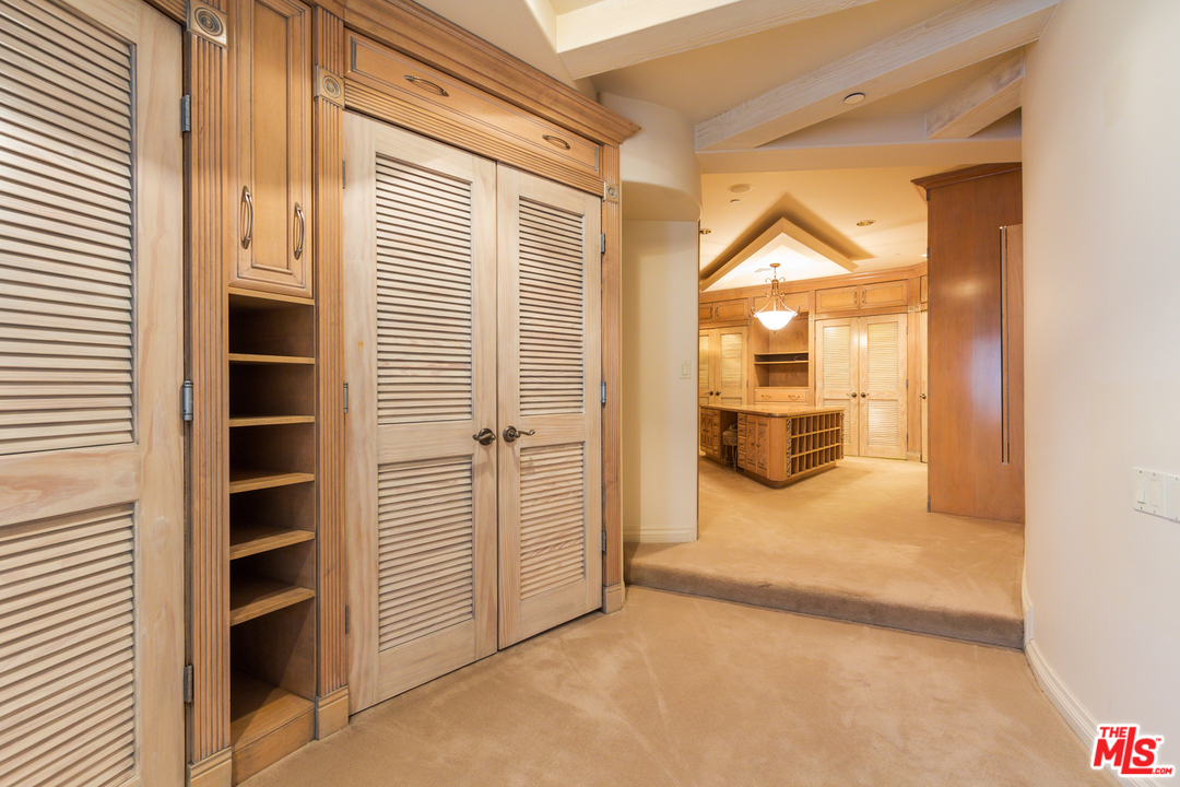 8570 Cole Crest Drive Los Angeles, CA 90046 - Photo 17 of 28 a view of walk in closet with empty racks