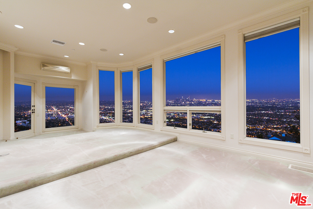 8570 Cole Crest Drive Los Angeles, CA 90046 - Photo 19 of 28 a view of an empty room with furniture and window