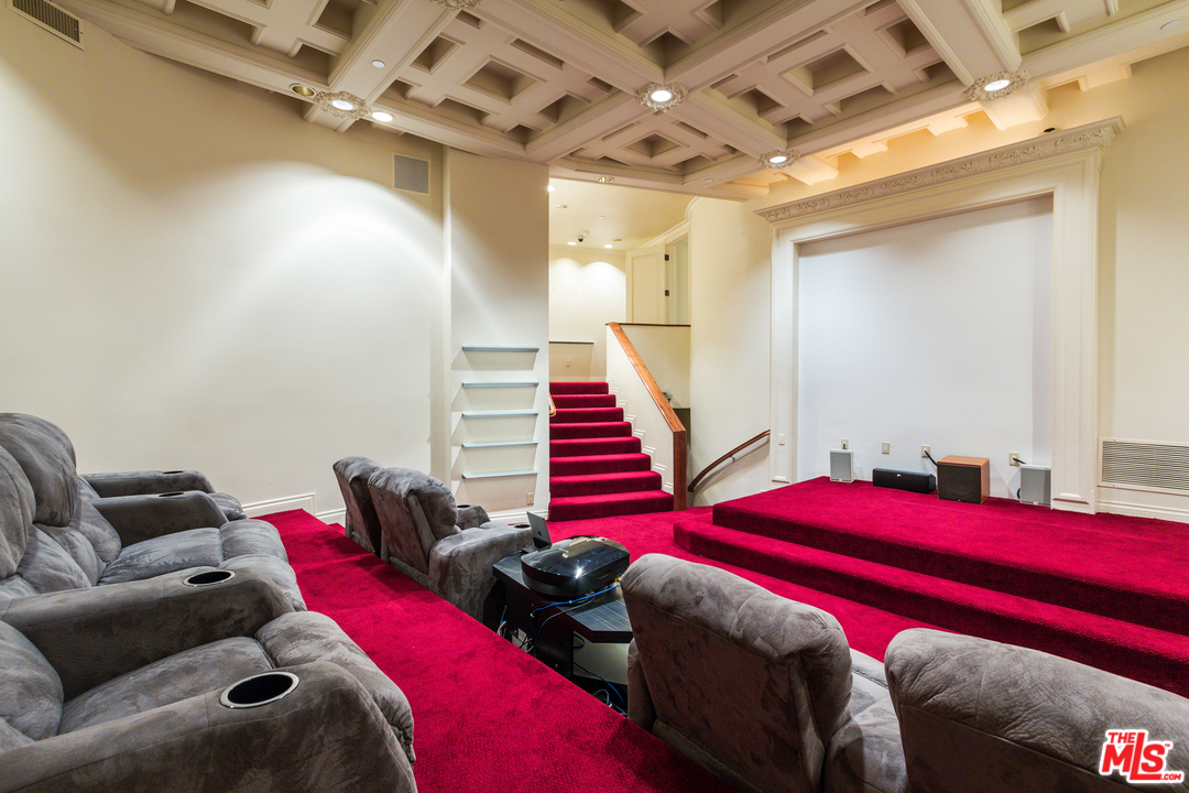 8570 Cole Crest Drive Los Angeles, CA 90046 - Photo 20 of 28 a bedroom with two bed and a couch