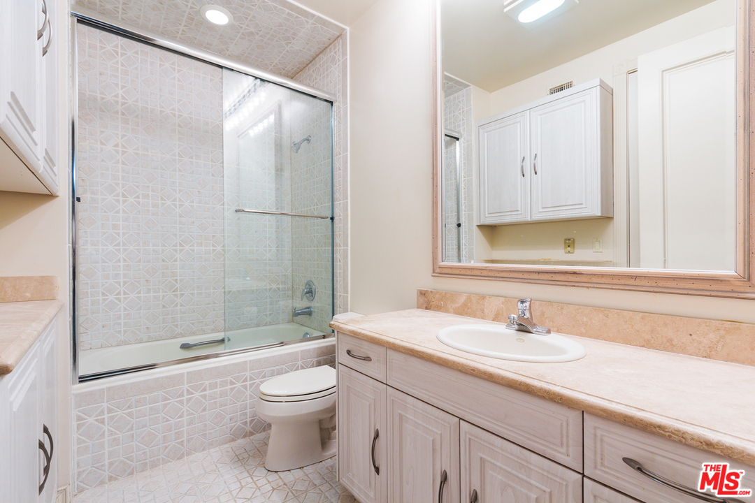 8570 Cole Crest Drive Los Angeles, CA 90046 - Photo 23 of 28 a bathroom with a sink toilet and shower