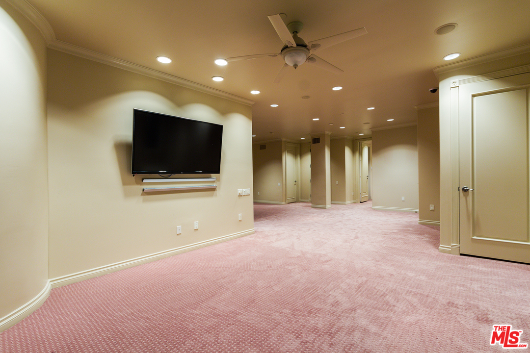 8570 Cole Crest Drive Los Angeles, CA 90046 - Photo 28 of 28 a view of a livingroom with a flat screen tv and outdoor space