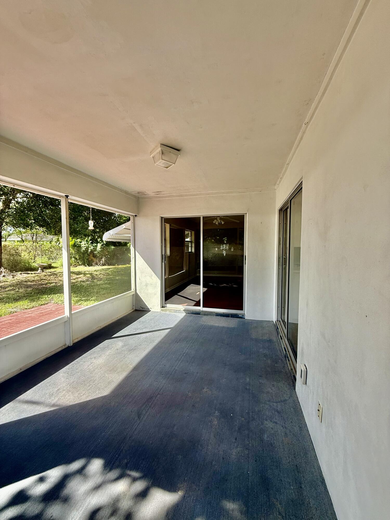 612 Coconut Avenue North Port St. Lucie, FL 34952 - Photo 12 of 32 a view of a room with furniture and large window