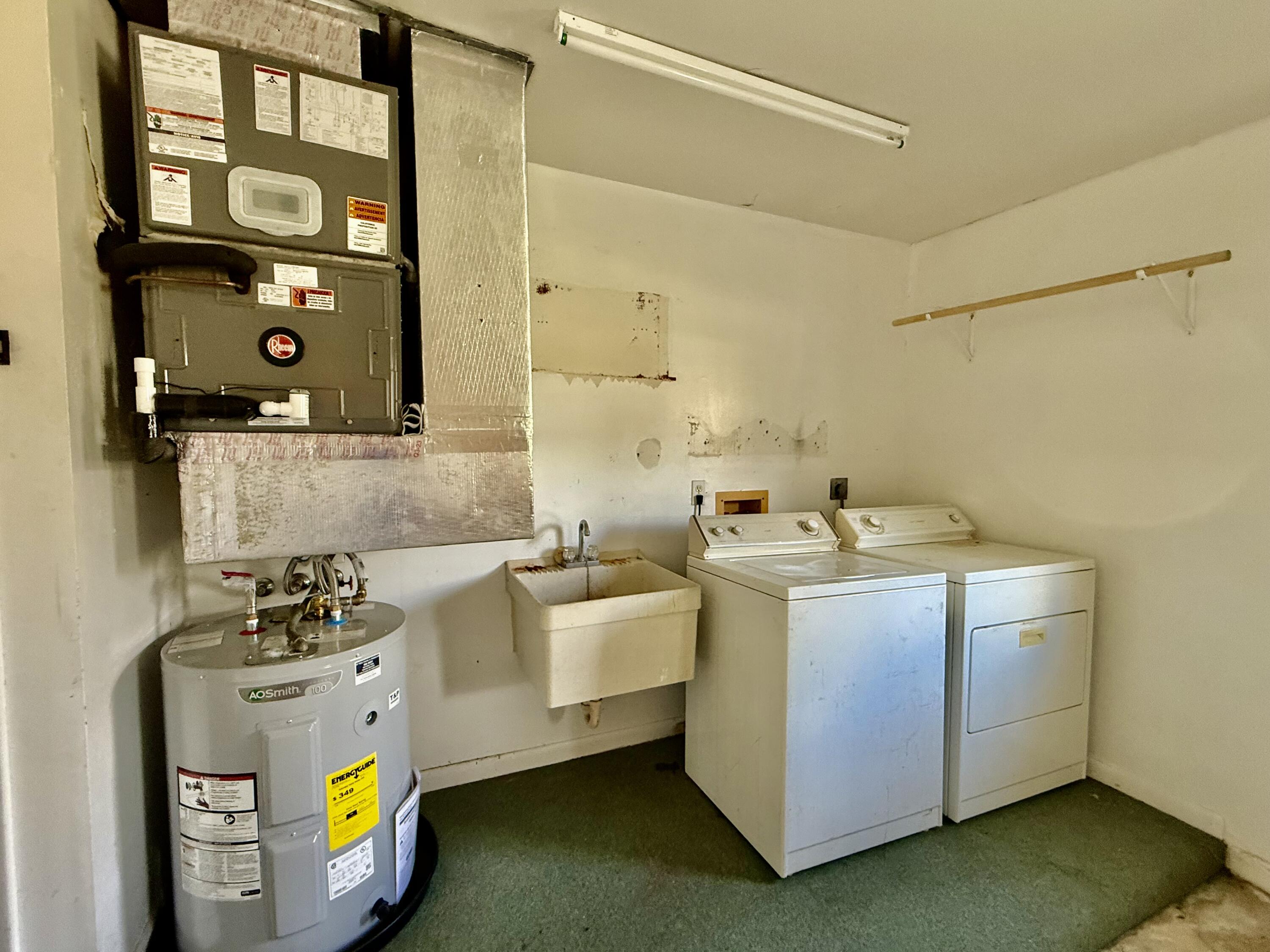 612 Coconut Avenue North Port St. Lucie, FL 34952 - Photo 19 of 32 a utility room with dryer and washer