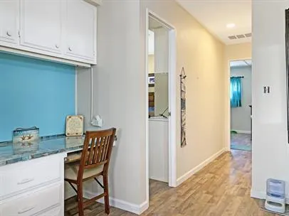 a view of kitchen with granite countertop furniture and wooden floor