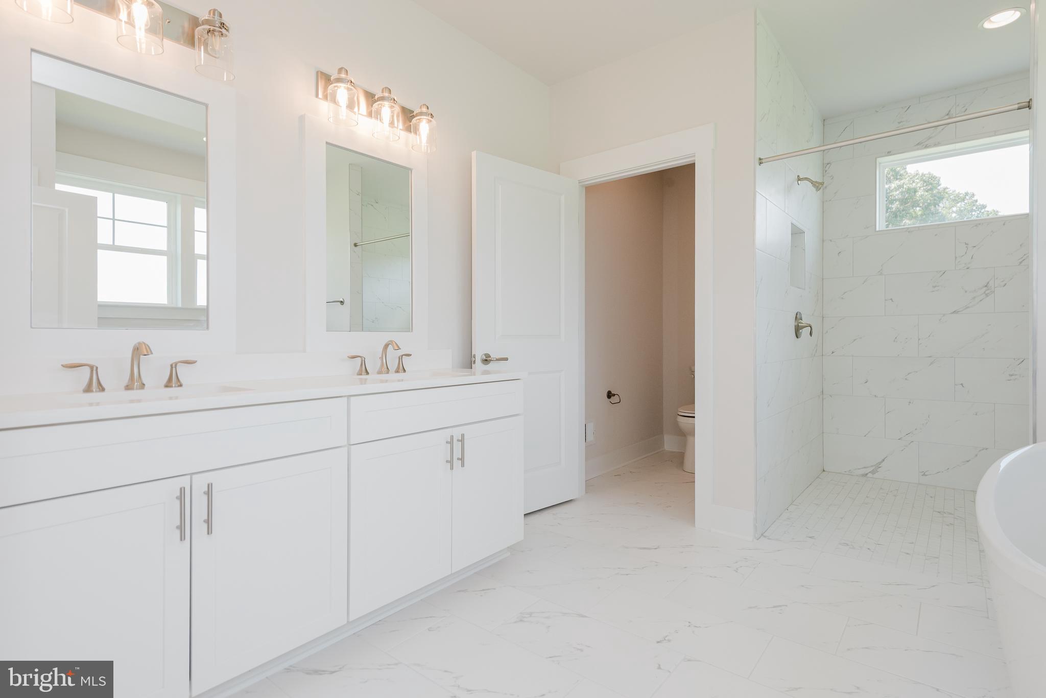 1605 Oakland Road Freeland, MD 21053 - Photo 11 of 57 a bathroom with double sink and a mirror