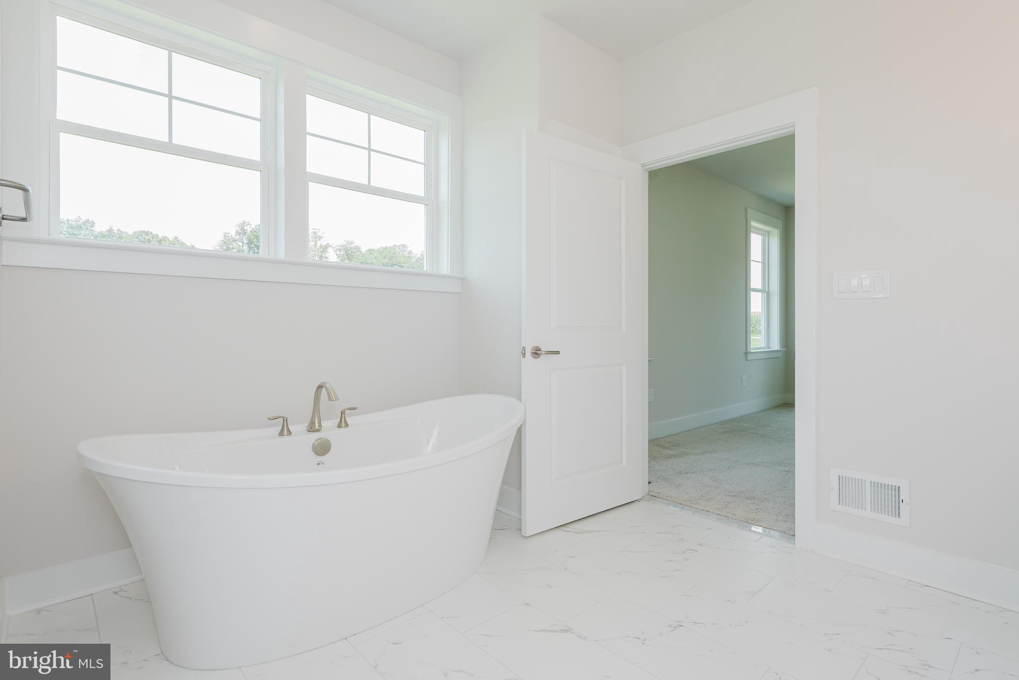 1605 Oakland Road Freeland, MD 21053 - Photo 13 of 57 a white bath tub sitting next to a window