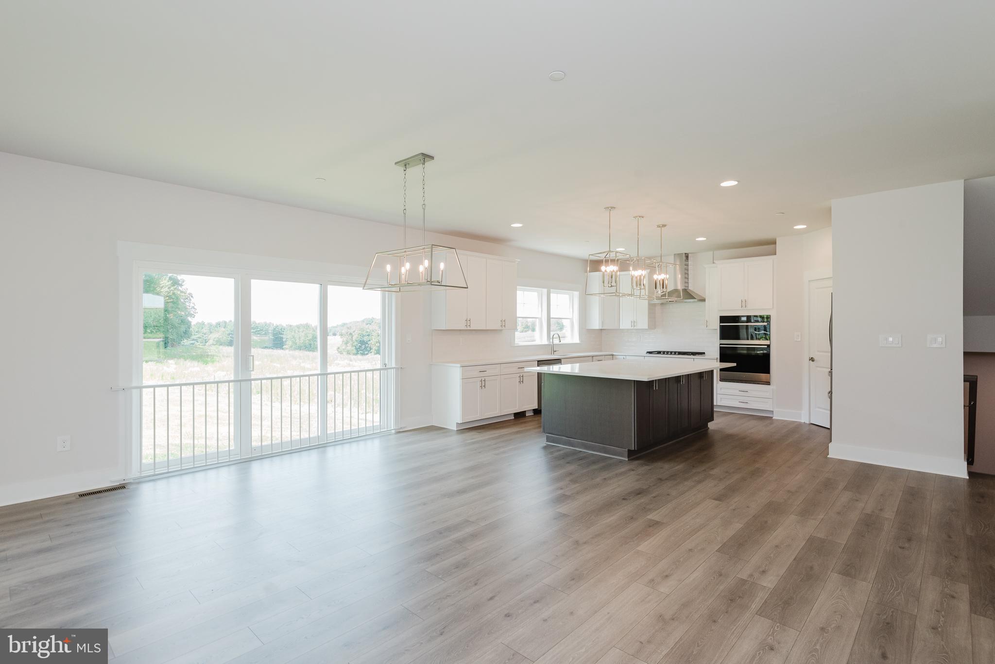 1605 Oakland Road Freeland, MD 21053 - Photo 15 of 57 a large kitchen with a large counter top and stainless steel appliances