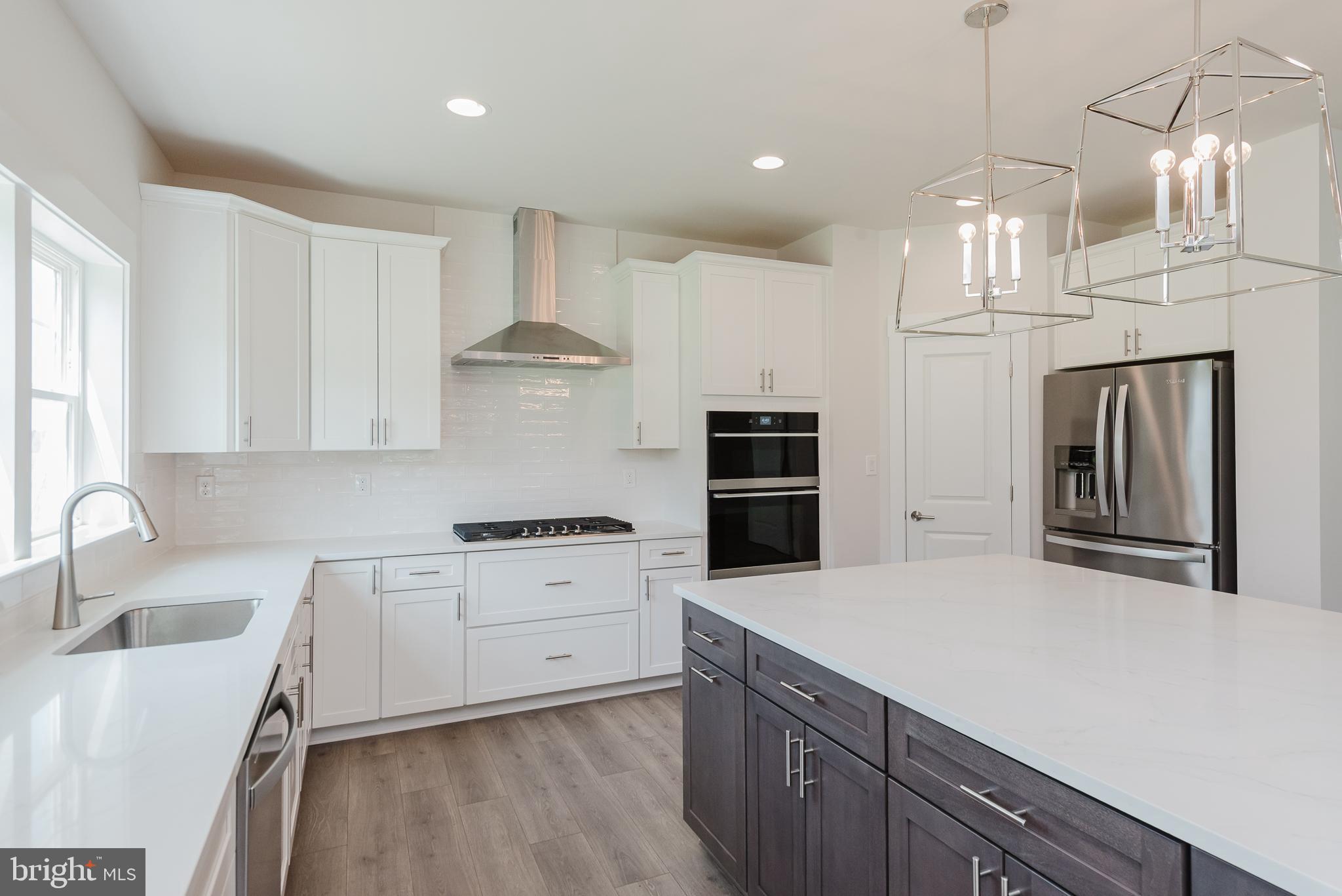 1605 Oakland Road Freeland, MD 21053 - Photo 17 of 57 a kitchen with granite countertop a sink stainless steel appliances and cabinets