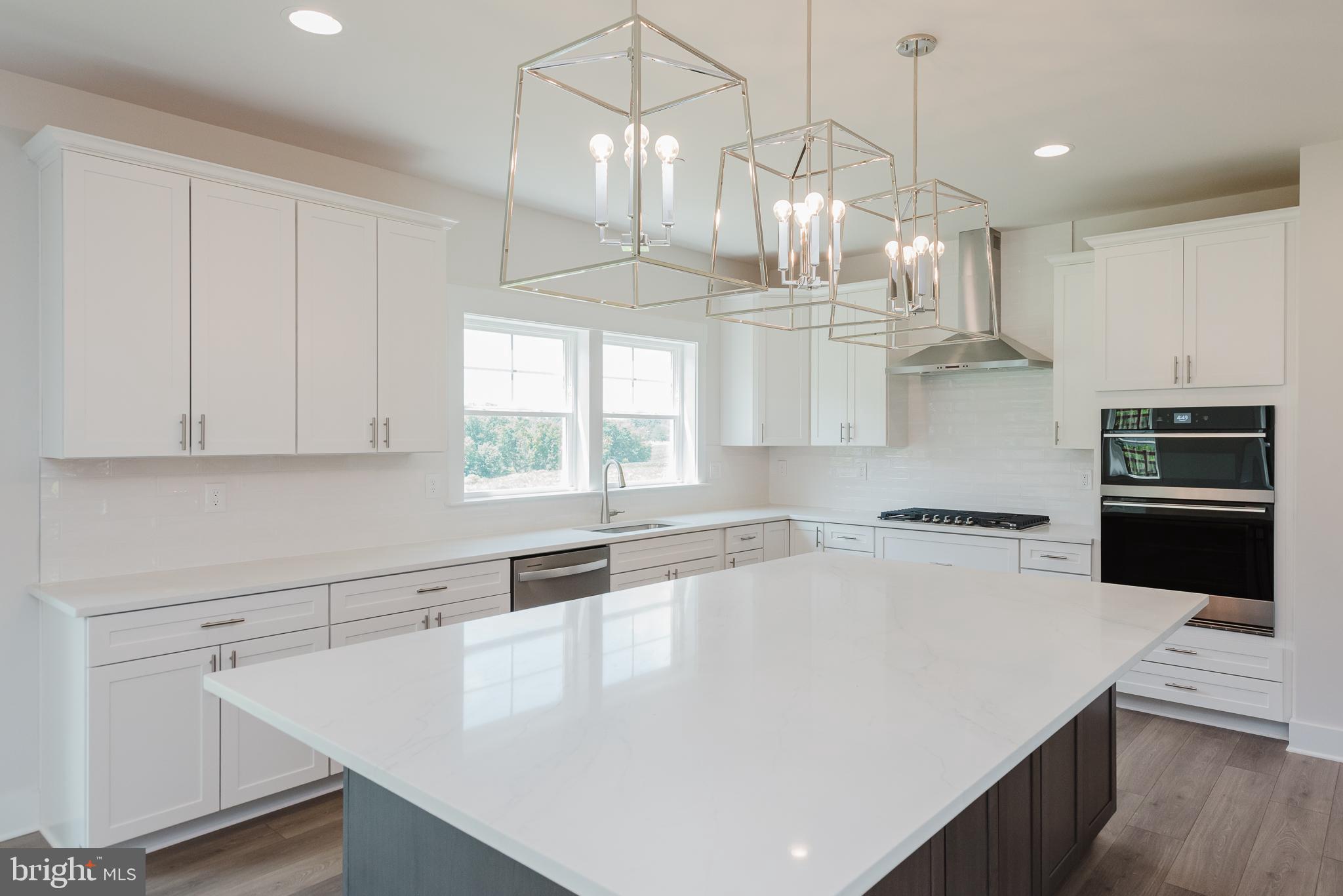 1605 Oakland Road Freeland, MD 21053 - Photo 20 of 57 a kitchen with a sink a stove and cabinets