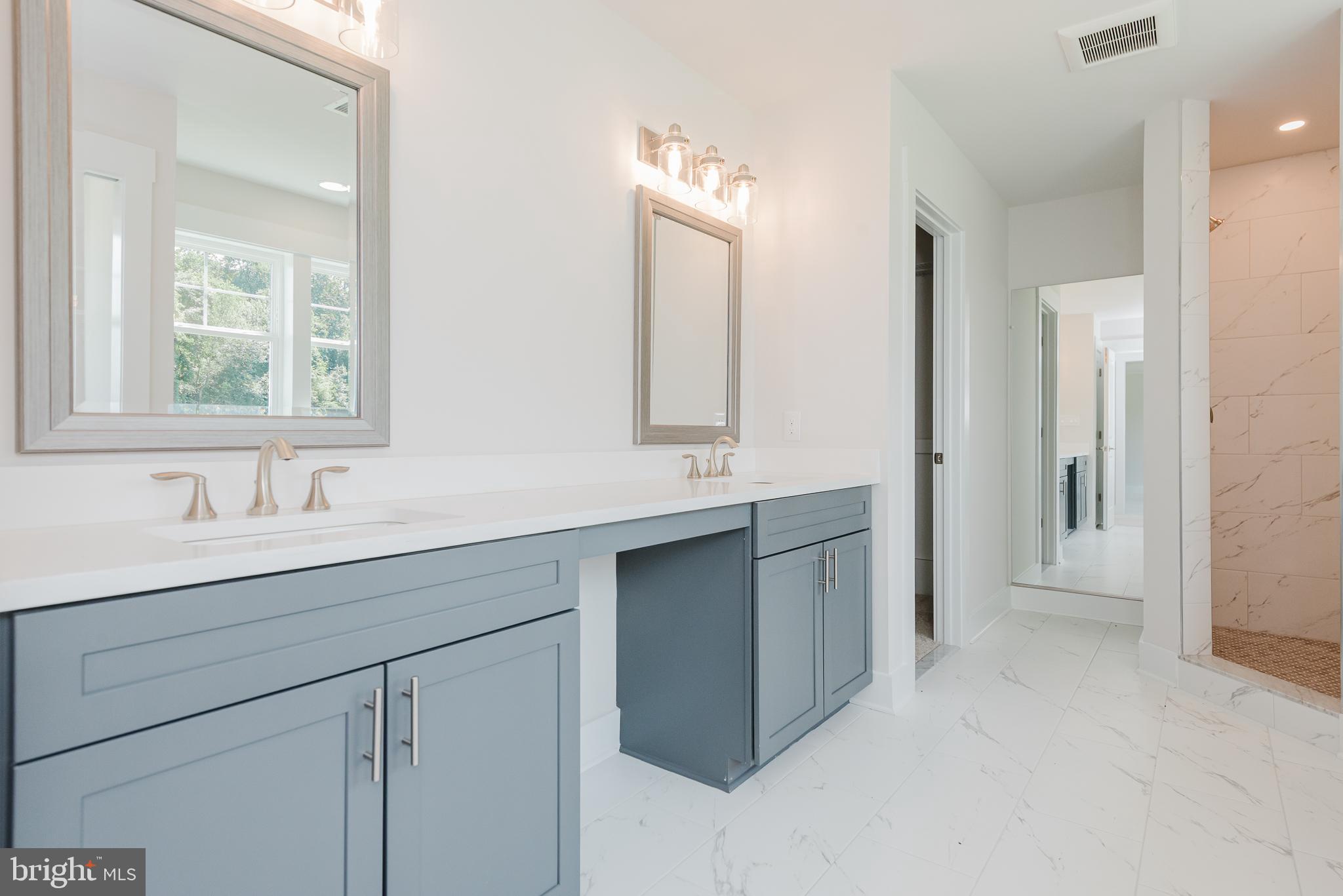 1605 Oakland Road Freeland, MD 21053 - Photo 29 of 57 a bathroom with 2 sink and a mirror