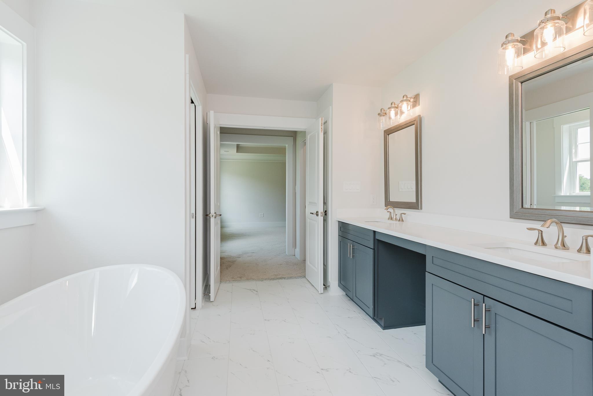 1605 Oakland Road Freeland, MD 21053 - Photo 33 of 57 a bathroom with a tub sink and mirror