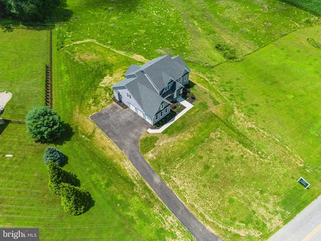 an aerial view of a golf course with a garden