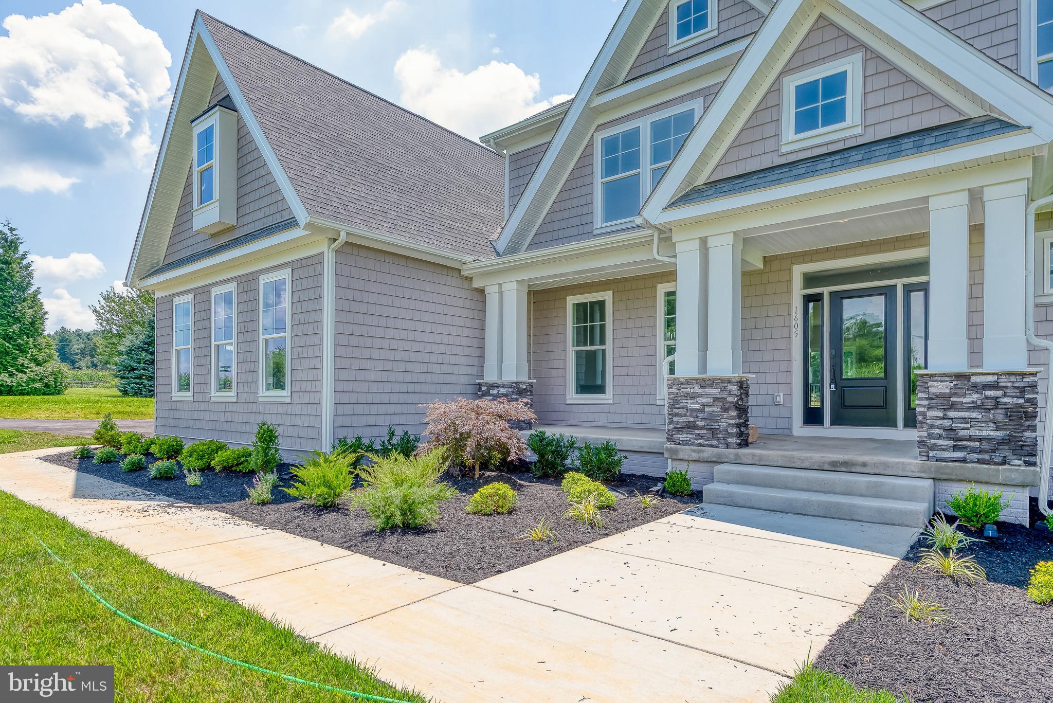 1605 Oakland Road Freeland, MD 21053 - Photo 5 of 57 a front view of a house with a garden