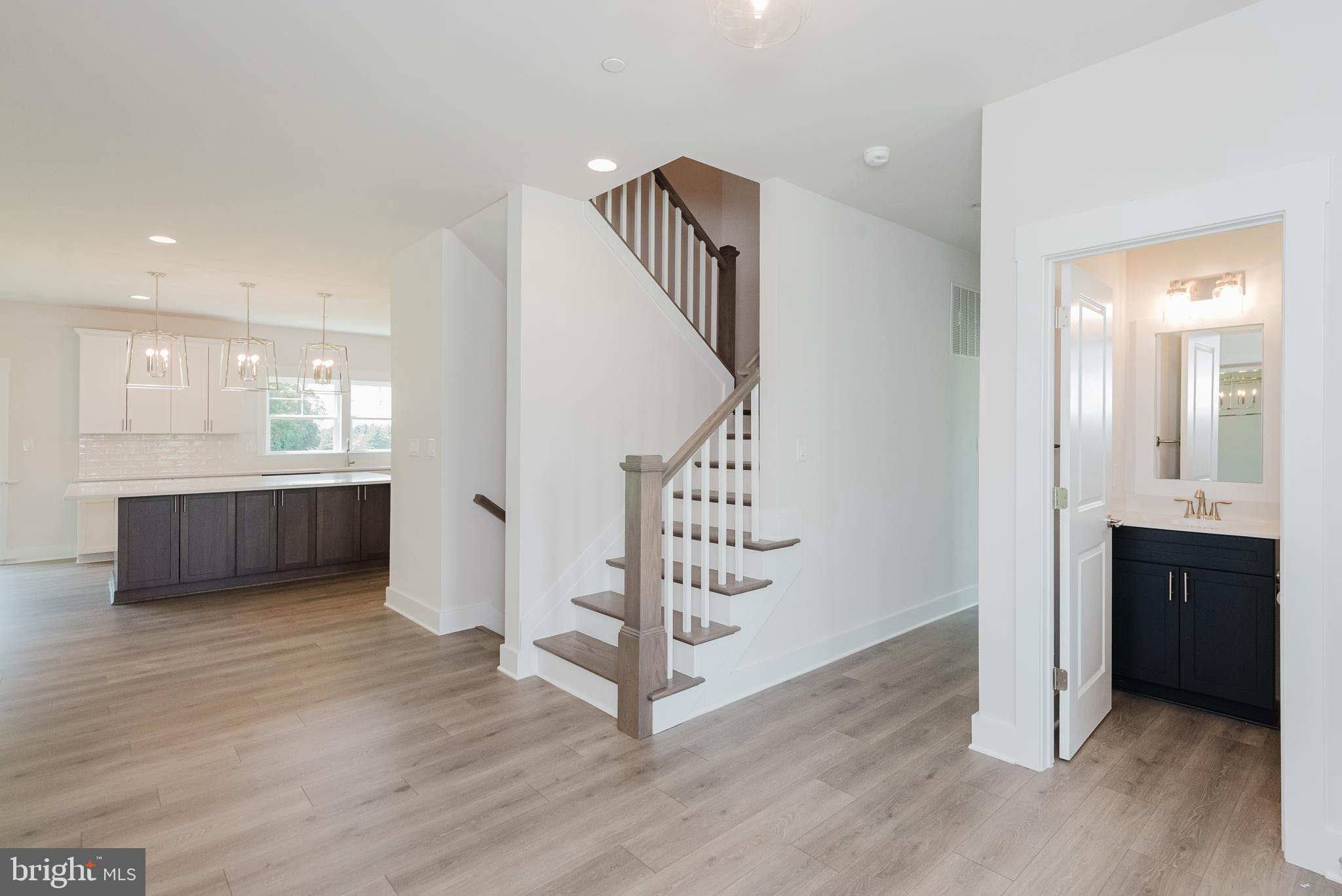 1605 Oakland Road Freeland, MD 21053 - Photo 7 of 57 a view of a hallway view with wooden floor and staircase