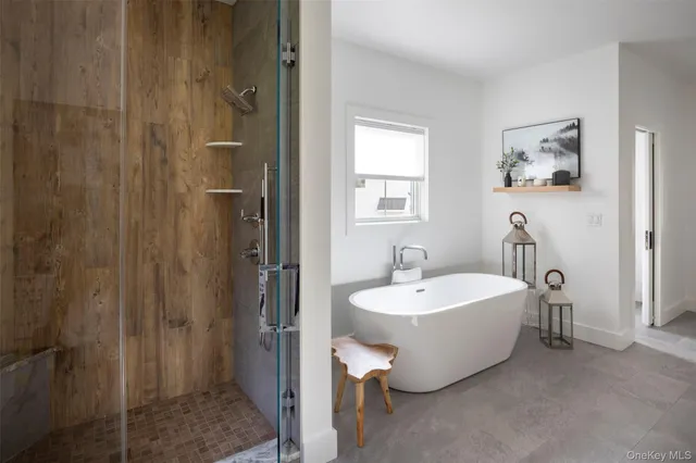 a spacious bathroom with sink and a mirror