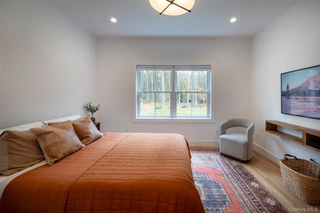 a bedroom with a bed and a couch