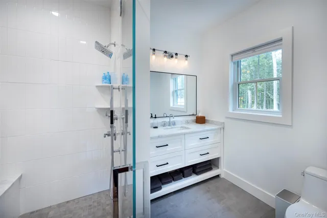 a room with a dresser and a window