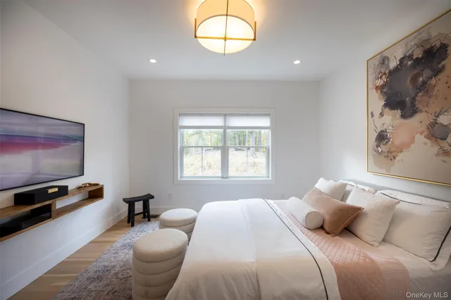 a bedroom with bed or couch and a window