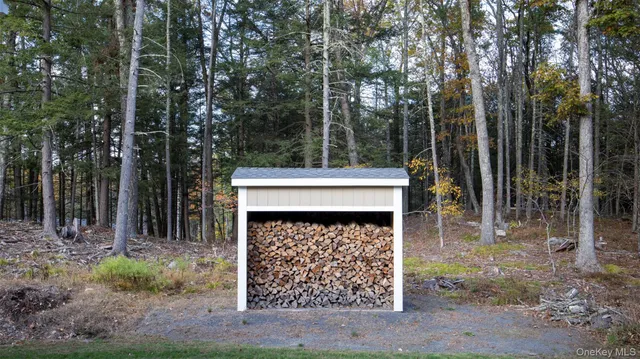 a view of a lake with chairs and tables