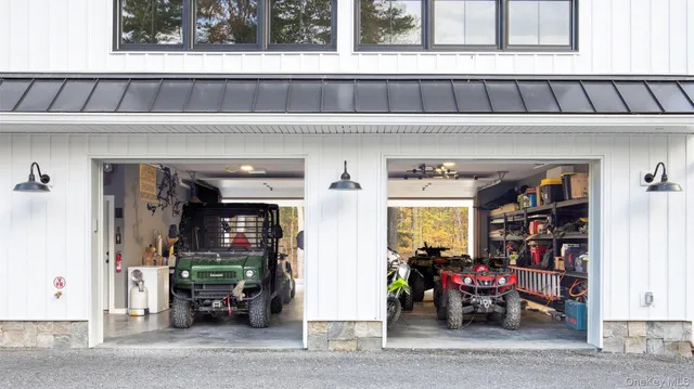 a kitchen with granite countertop white cabinets and refrigerator