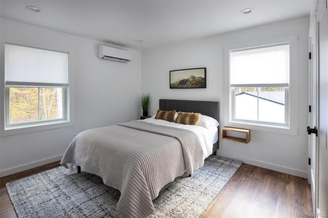 a view of house with backyard and seating space